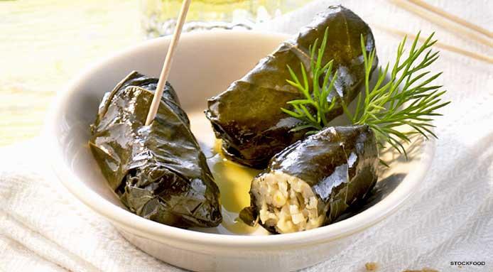 Rolls of rice wrapped in Vine leaves (Dolmadakia), served with Greek yogurt