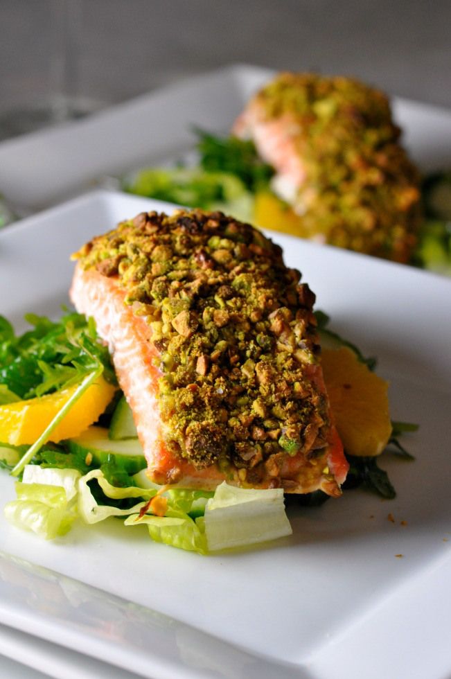 Roast salmon fillet topped with pistachios and parmesan flakes